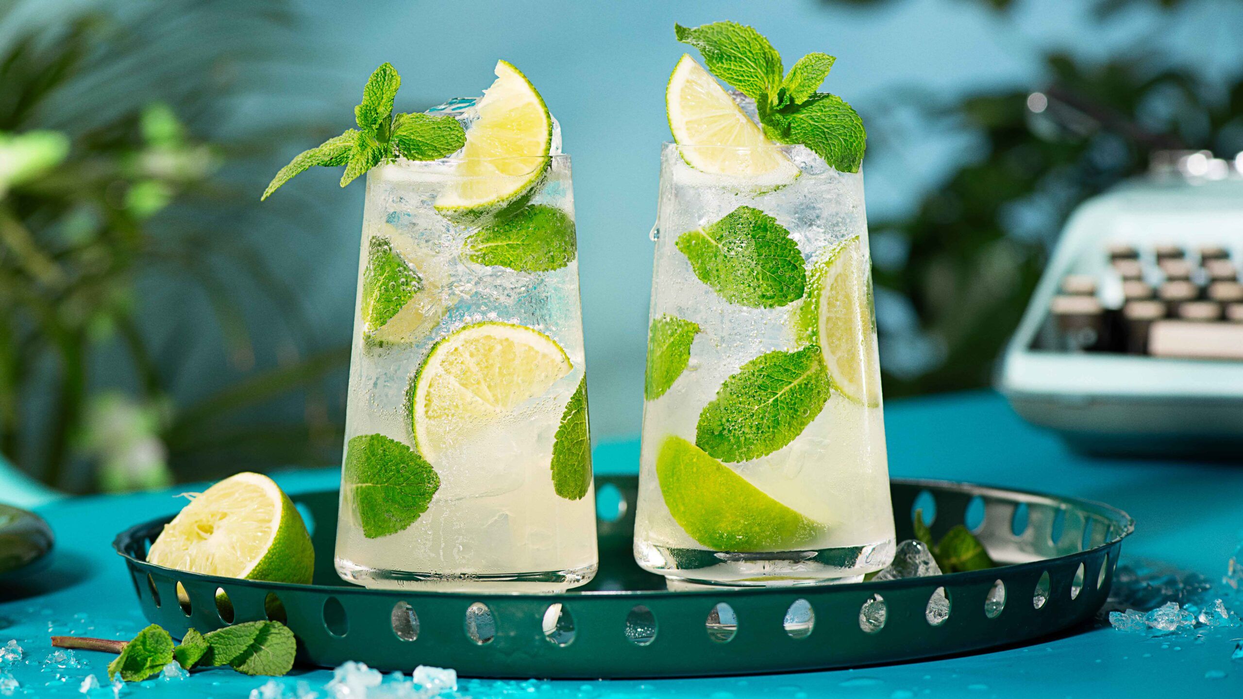 2 Malibu Mojito cocktails on a serving tray, against a blue background