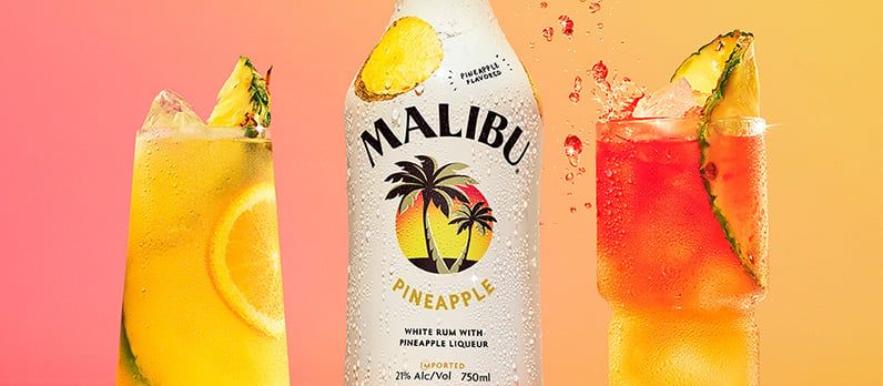 Malibu pineapple bottle and two cocktails