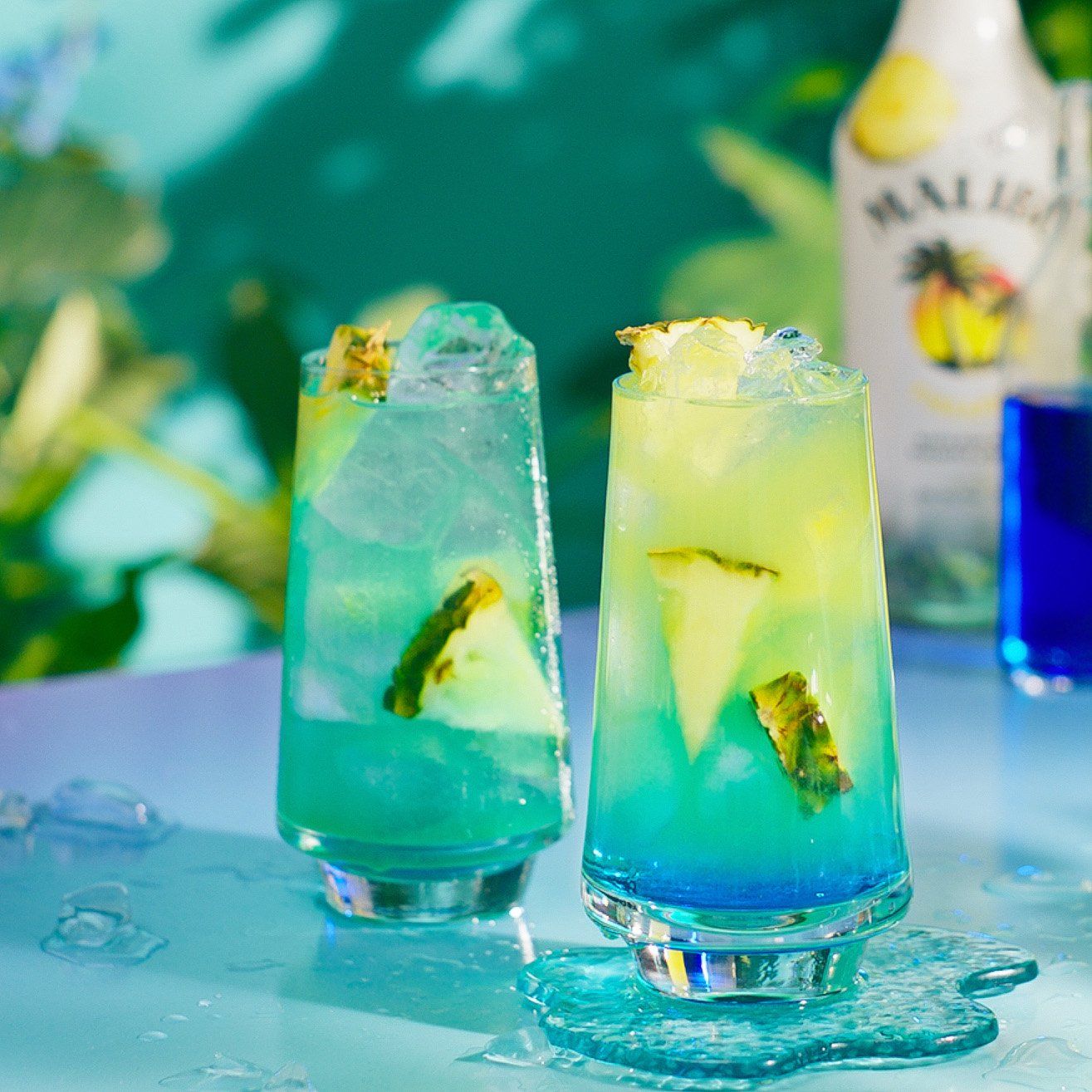 Two Blue Hawaiian cocktails in a tropical setting - step 6