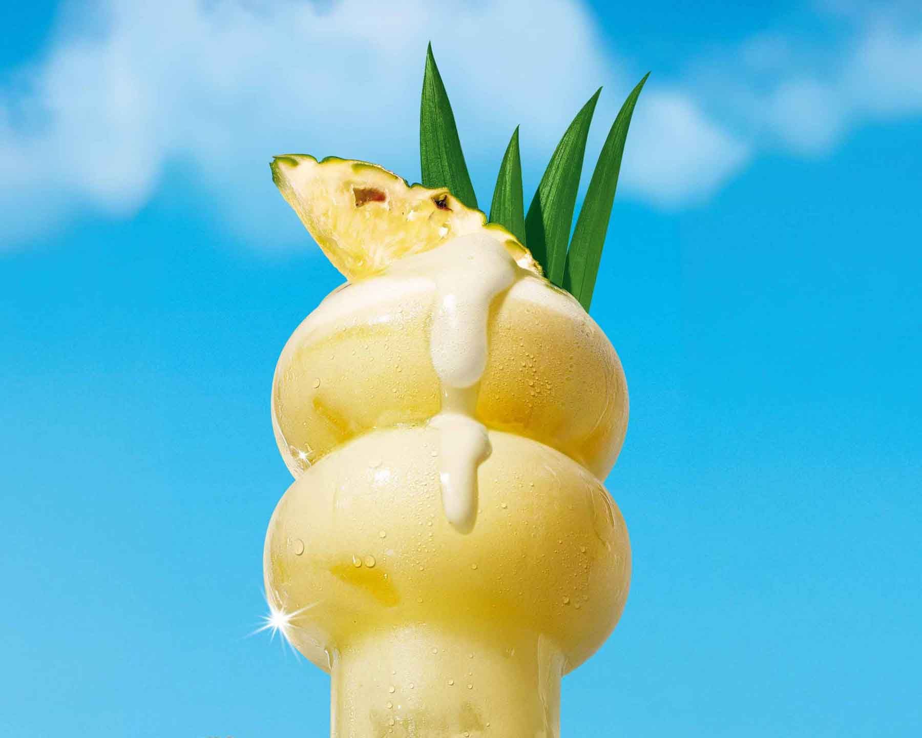 Malibu Pina colada cocktail on a blue background