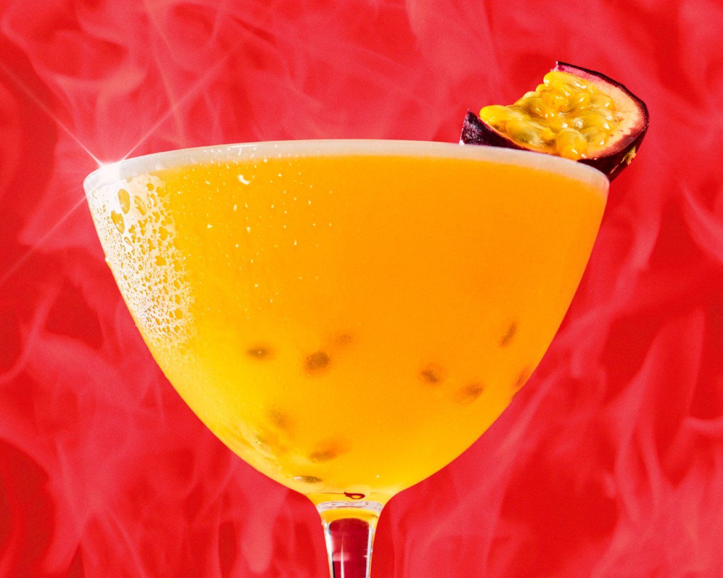 Porn star martini drink close up, with passion fruit garnish