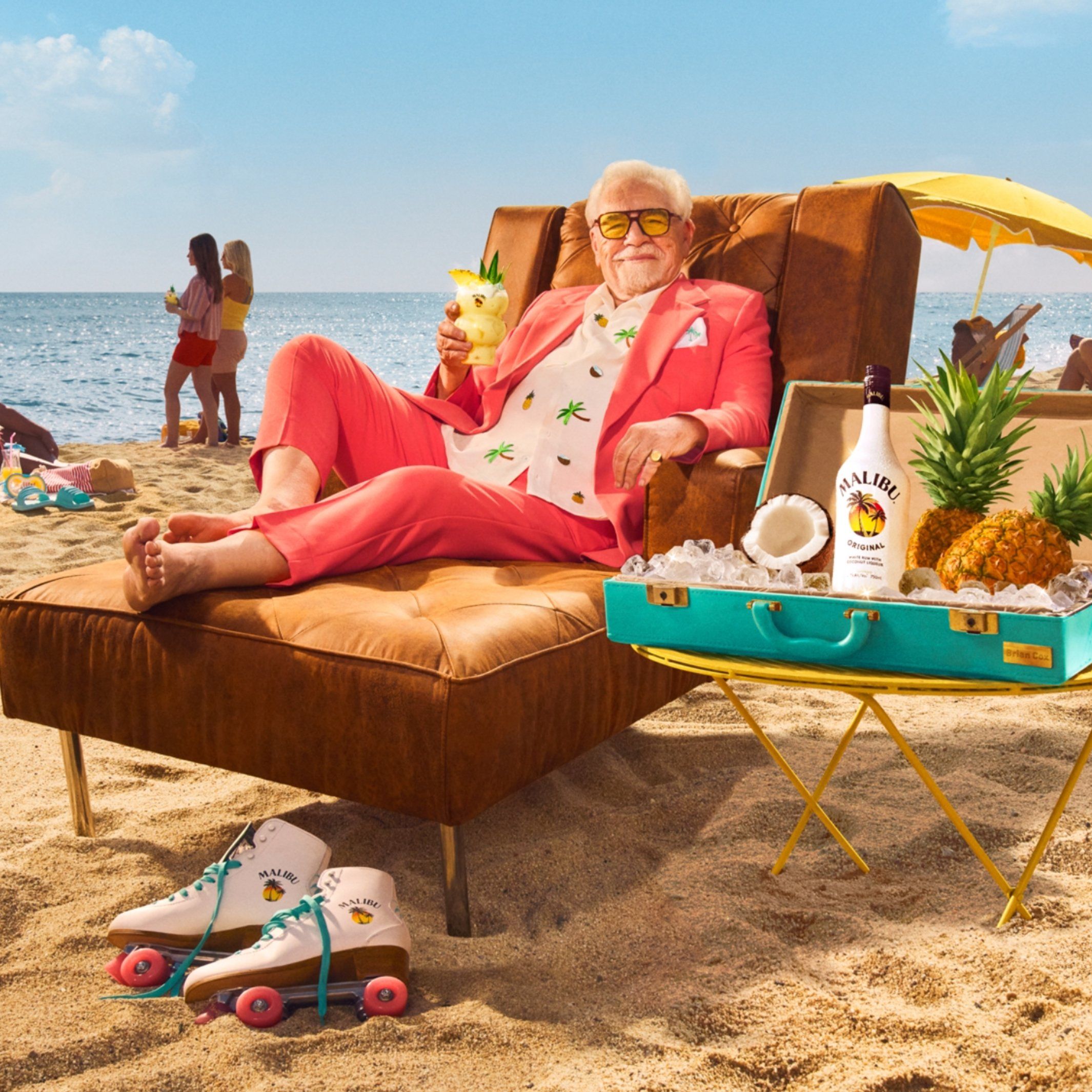 Brian Cox enjoying a Pina Colada on the beach