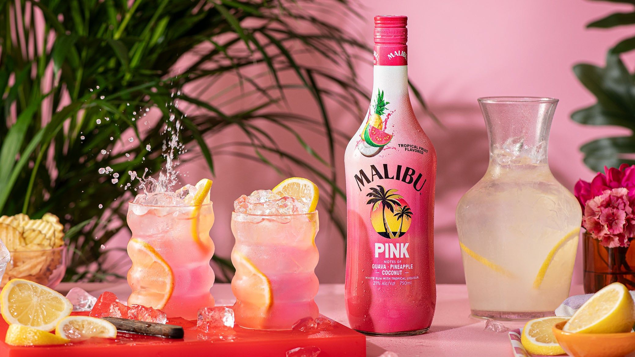 2 Malibu Pink Lemonades on a pink serving tray, next to a Malibu Pink Bottle