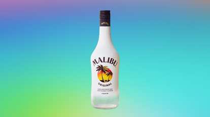 Malibu Original bottle with white frosted surface and condensation droplets, dark cap with gold logo, and sunset palm label, centered on a soft gradient background shifting from purple to turquoise and green.