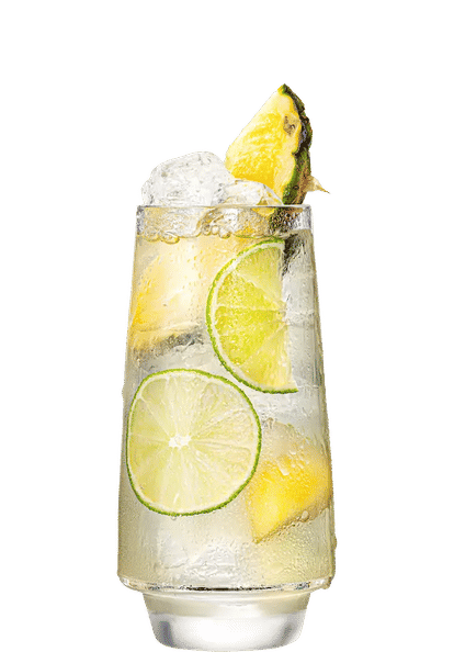 Malibu Coconut Water Piña Colada cocktail in a tall glass with clear light drink, ice cubes, lime slices, and pineapple chunks, condensation on the glass, isolated on a white background.
