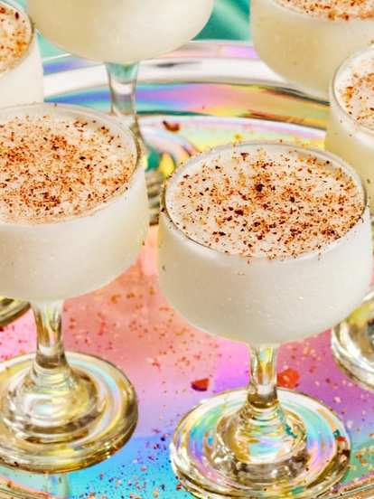 A tray of Malibu Coquito drinks in a festive setting