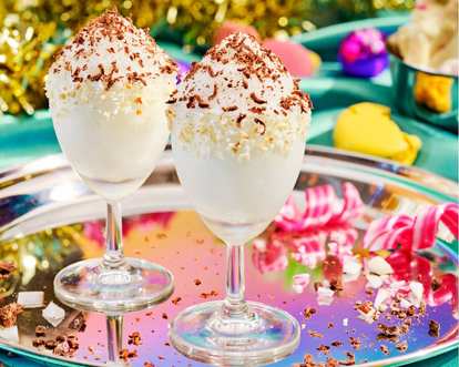 Two glasses of Malibu Snow Colada in a festive holiday setting