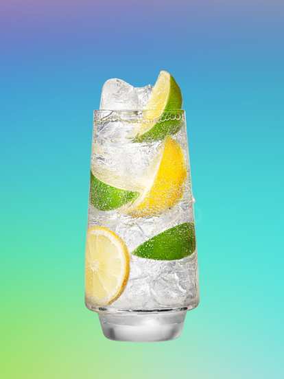 Malibu Lemon‑Lime Soda — a tall, sparkling cocktail with ice, lemon and lime wedges, and fizzy bubbles, set against a turquoise‑to‑purple gradient background for a crisp, refreshing look.