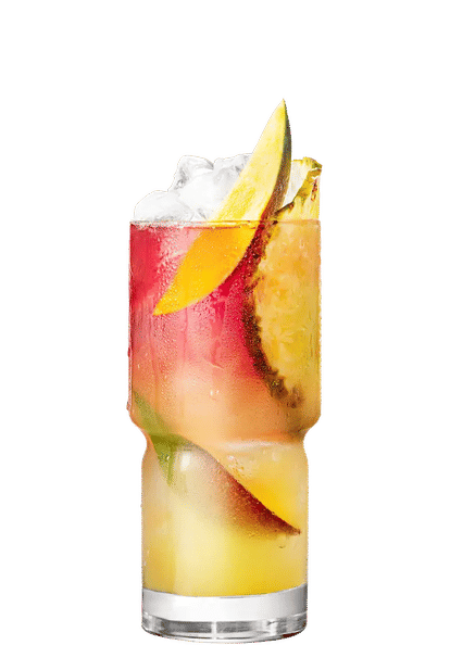Malibu Mango Bay Breeze cocktail in a tall glass with layered yellow and pink drink, ice cubes, mango slices, and pineapple wedge garnish, condensation on the glass, isolated on a white background.