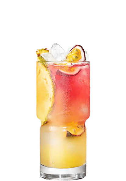 Malibu Passion Fruit Bay Breeze cocktail in a tall glass with layered yellow and pink drink, ice cubes, pineapple slice, and halved passion fruit garnish, isolated on a white background.