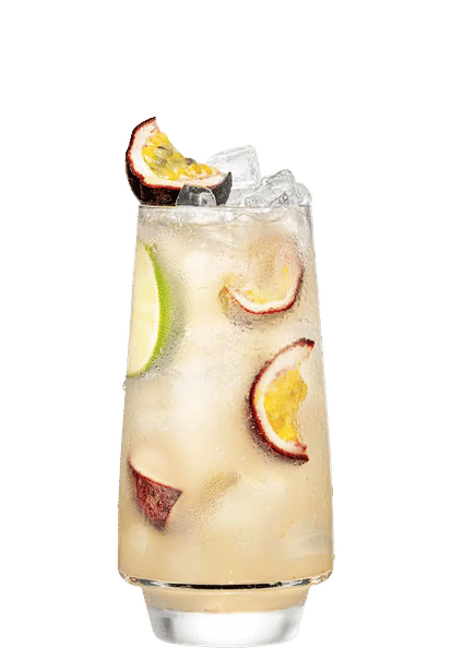Malibu Passion Fruit Lemonade cocktail in a tall glass with pale yellow drink, ice cubes, lime wedges, and halved passion fruit garnish, condensation on the glass, isolated on a white background.