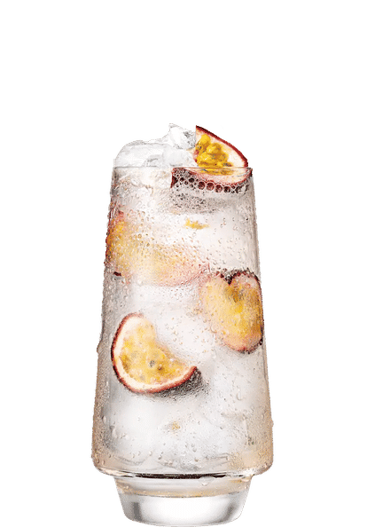 Malibu Passion Fruit & Soda Water cocktail in a tall glass with clear sparkling drink, ice cubes, halved passion fruit pieces, and condensation on the glass, isolated on a white background.