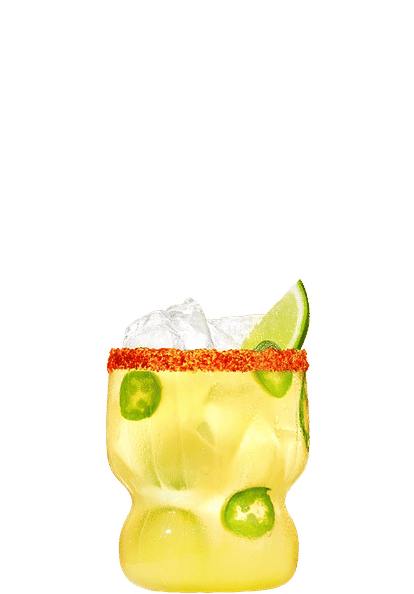 One Malibu Toreada cocktail in a rocks glass garnished with a lime wedge in front of a transparent background