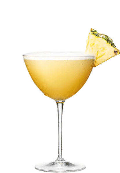 Malibu Pineapple Daiquiri cocktail in a coupe glass with golden yellow drink and a pineapple wedge garnish, smooth frothy surface and isolated on a white background.