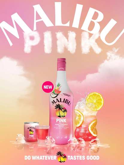 Malibu Pink Bottle and drinks in front of a colourful background with clouds
