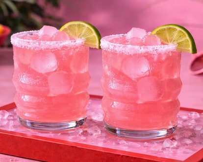 Two glasses of Malibu Pink Margarita decorated with lime