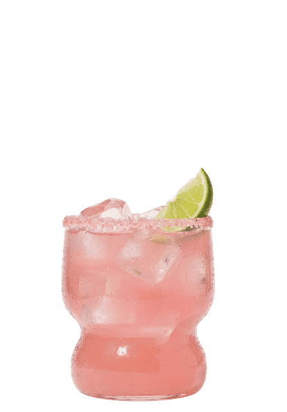 Malibu Pink Margarita cocktail in a rocks glass with ice and a lime wedge garnish, rimmed with pink salt and isolated on a white background.