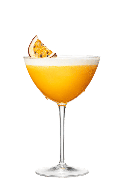 One Pornstar Martini cocktail in a martini glass garnished with a passion fruit slice in front of a transparent background