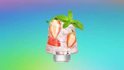 Malibu Rose Spritz served over ice with fresh strawberry slices and mint leaves for a light, sparkling tropical cocktail.