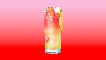 Malibu Strawberry Bay Breeze served over ice with strawberry and pineapple slices for a vibrant, fruity tropical cocktail.
