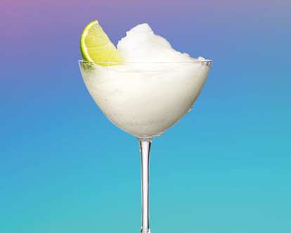 Malibu Frozen Daiquiri served in a martini glass with a slice of lime