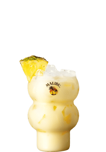 Malibu Dirty Coconut — a creamy tropical cocktail served in a curvy Malibu‑branded glass with ice and pineapple chunks, garnished with a fresh pineapple wedge for a smooth, island‑style look.